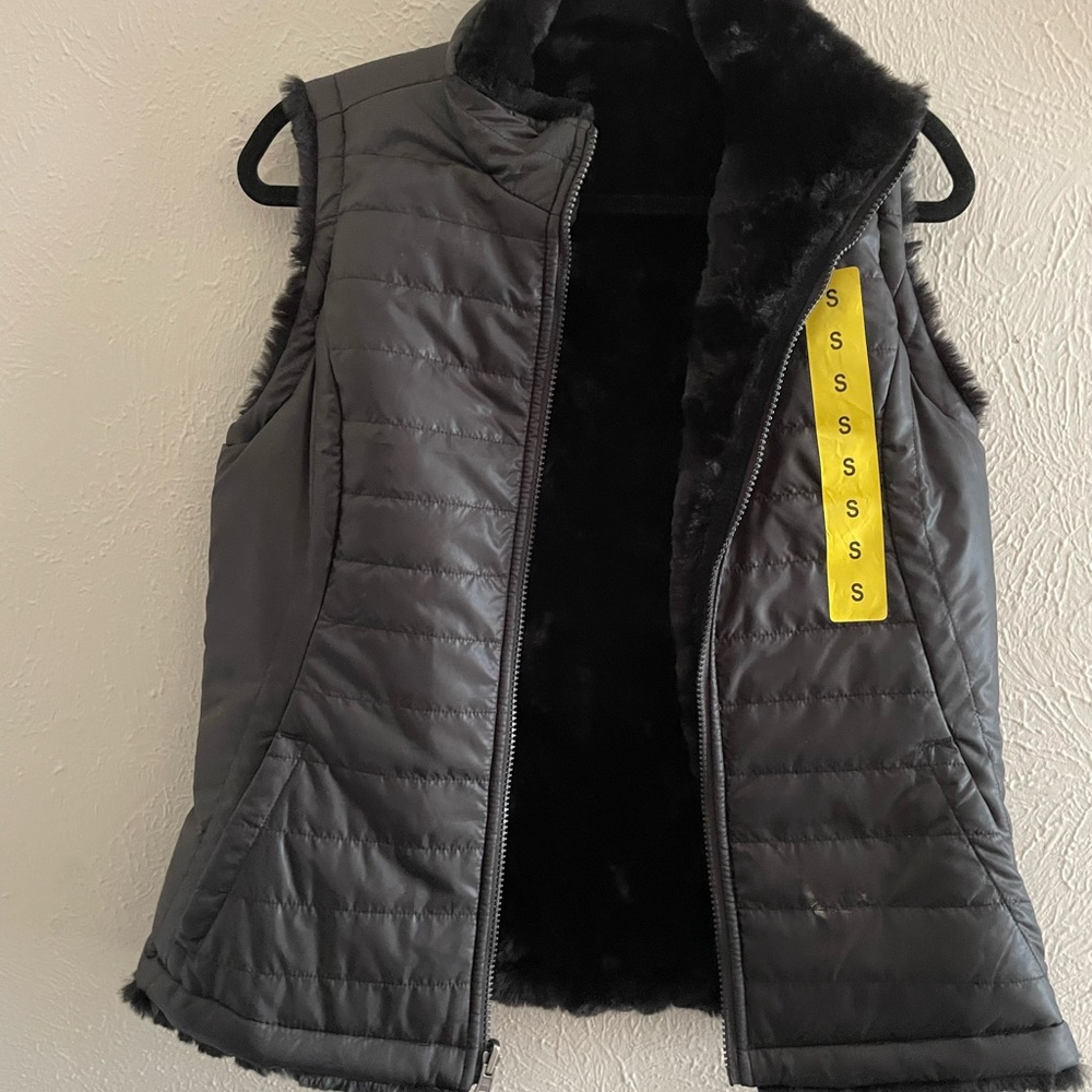 Brand new Reversible Nicole miller vest .
